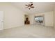 Spacious bedroom with walkout balcony access and a separate vanity area at 4620 N Tee Pee Ln, Las Vegas, NV 89129