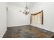 Inviting dining room with tile floors, chandelier, and elegant window treatments at 4620 N Tee Pee Ln, Las Vegas, NV 89129