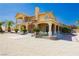 Charming two-story home featuring balconies, covered porch, and desert landscaping at 4620 N Tee Pee Ln, Las Vegas, NV 89129
