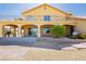 Impressive two-story home featuring a terracotta roof, decorative balcony, and brick-paved patio at 4620 N Tee Pee Ln, Las Vegas, NV 89129