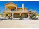 Two-story house with a balcony, columns, staircase, and drought tolerant landscaping at 4620 N Tee Pee Ln, Las Vegas, NV 89129