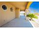 Covered outdoor area with arched columns and a spiral staircase at 4620 N Tee Pee Ln, Las Vegas, NV 89129