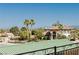 Gorgeous home featuring a terracotta roof, manicured front yard, and two palm trees at 4620 N Tee Pee Ln, Las Vegas, NV 89129