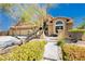 Charming single-Gathering home featuring a well-manicured front yard and a spacious three-car garage at 4620 N Tee Pee Ln, Las Vegas, NV 89129