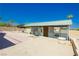 Functional horse barn with stalls, paved area, and ample space for equestrian activities at 4620 N Tee Pee Ln, Las Vegas, NV 89129