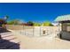 Fenced horse enclosure with gravel, brick perimeter, and shaded shelter at 4620 N Tee Pee Ln, Las Vegas, NV 89129