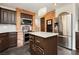 Beautiful kitchen with stainless steel appliances and brick accent wall detail at 4620 N Tee Pee Ln, Las Vegas, NV 89129