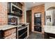Cozy kitchen with stainless steel appliances and unique brick accents at 4620 N Tee Pee Ln, Las Vegas, NV 89129