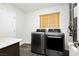 Modern laundry room featuring front load washer and dryer at 4620 N Tee Pee Ln, Las Vegas, NV 89129