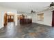 Open-concept living space with bar, fireplace, and easy access to other rooms at 4620 N Tee Pee Ln, Las Vegas, NV 89129