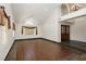 Bright, open-concept living room with high ceilings, hardwood floors, and double front door at 4620 N Tee Pee Ln, Las Vegas, NV 89129