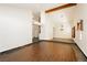 Open-concept living space with hardwood floors, high ceilings, and access to upper level at 4620 N Tee Pee Ln, Las Vegas, NV 89129