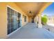 Covered outdoor patio area with arched columns, exterior lighting, and ceiling fans at 4620 N Tee Pee Ln, Las Vegas, NV 89129