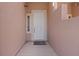 A welcoming private entrance with modern door, next to a unique decorative window at 5603 Deer Creek Falls Ct, Las Vegas, NV 89118