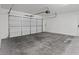 A spacious three car garage with concrete floors and an automatic door at 5603 Deer Creek Falls Ct, Las Vegas, NV 89118
