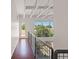 Hallway with steel railing and large windows showing neighborhood at 5603 Deer Creek Falls Ct, Las Vegas, NV 89118