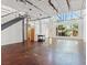 Bright and airy living room with high ceilings, large windows, and a modern fireplace at 5603 Deer Creek Falls Ct, Las Vegas, NV 89118