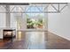 Bright living room with fireplace and large windows with backyard view at 5603 Deer Creek Falls Ct, Las Vegas, NV 89118
