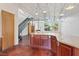 View of kitchen island, metal staircase, and exposed ceiling in living space at 5603 Deer Creek Falls Ct, Las Vegas, NV 89118