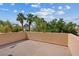 Exterior patio showcasing blue skies, palm trees, and lush landscaping at 5603 Deer Creek Falls Ct, Las Vegas, NV 89118