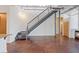 Industrial-style staircase leading to upper level, with open floor plan and modern finishes at 5603 Deer Creek Falls Ct, Las Vegas, NV 89118