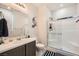 Modern bathroom featuring a vanity, toilet, and a glass-enclosed shower at 5660 Oasis Ridge St, North Las Vegas, NV 89031