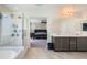 Bright bathroom showcasing a shower, bathtub, and double vanity sink at 5660 Oasis Ridge St, North Las Vegas, NV 89031