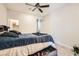 Comfortable bedroom featuring a ceiling fan and a view into the closet at 5660 Oasis Ridge St, North Las Vegas, NV 89031