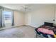 Spacious bedroom with a window, a carpeted floor, ceiling fan, and a bed at 5660 Oasis Ridge St, North Las Vegas, NV 89031