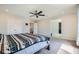 Bedroom featuring a ceiling fan and access to the hallway and other rooms at 5660 Oasis Ridge St, North Las Vegas, NV 89031