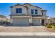Attractive two-story home with a two-car garage and brick-paved driveway at 5660 Oasis Ridge St, North Las Vegas, NV 89031
