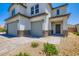 Charming two-story home featuring a three-car garage and beautiful stone accents at 5660 Oasis Ridge St, North Las Vegas, NV 89031