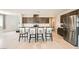 Modern kitchen featuring a center island, stainless steel appliances, and an abundance of cabinet space at 5660 Oasis Ridge St, North Las Vegas, NV 89031