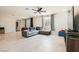 Inviting living room with tiled floor, ceiling fan, and plenty of natural light at 5660 Oasis Ridge St, North Las Vegas, NV 89031
