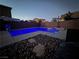 Beautiful backyard pool featuring in-ground pool with stone and concrete accents, perfect for entertaining at 5660 Oasis Ridge St, North Las Vegas, NV 89031
