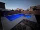 Beautiful backyard pool featuring in-ground pool with stone and concrete accents, perfect for entertaining at 5660 Oasis Ridge St, North Las Vegas, NV 89031