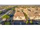 Expansive aerial view of a well-planned community with neatly arranged townhouses featuring terracotta tile roofs at 5855 Valley Dr # 2145, North Las Vegas, NV 89031