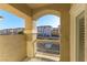 Balcony view of the community featuring desert landscaping and stucco-clad buildings under a bright blue sky at 5855 Valley Dr # 2145, North Las Vegas, NV 89031
