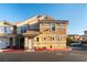 Inviting townhouse with a red tile roof, tan stucco, a red fire hydrant, and well-maintained landscaping at 5855 Valley Dr # 2145, North Las Vegas, NV 89031