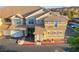 Beige stucco townhome with a red tile roof and lush desert landscaping in front at 5855 Valley Dr # 2145, North Las Vegas, NV 89031