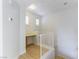 Bright landing area with white walls, wood laminate floors, and a built-in desk illuminated by natural light at 5855 Valley Dr # 2145, North Las Vegas, NV 89031