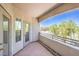 Charming balcony with a view of neighborhood trees and homes, inviting relaxation at 6160 Rumrill St # 215, Las Vegas, NV 89113