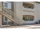 Exterior view of a well-maintained apartment building with stair access to upper units at 6160 Rumrill St # 215, Las Vegas, NV 89113