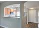 Updated kitchen featuring wood cabinets, stainless steel appliances, and a convenient breakfast bar at 6160 Rumrill St # 215, Las Vegas, NV 89113