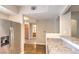 View of the kitchen with stainless steel appliances, granite countertops, and wood-look flooring at 6160 Rumrill St # 215, Las Vegas, NV 89113