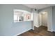 Bright, open living space with wood floors that flows into the kitchen through a stylish pass-through at 6160 Rumrill St # 215, Las Vegas, NV 89113