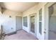 Private patio featuring a door, window, and textured walls, creating a cozy outdoor space at 6160 Rumrill St # 215, Las Vegas, NV 89113