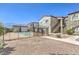Community pool area behind a secure fence, with manicured landscaping and building in the background at 6160 Rumrill St # 215, Las Vegas, NV 89113