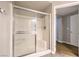Shower with glass sliding doors and a built-in seat at 6160 Rumrill St # 215, Las Vegas, NV 89113