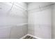 Walk-in closet with white wire shelving and wood-look flooring at 6160 Rumrill St # 215, Las Vegas, NV 89113